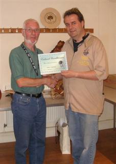 The monthly Highly commended Arthur Clatworthy received his certificate from Gary Rance